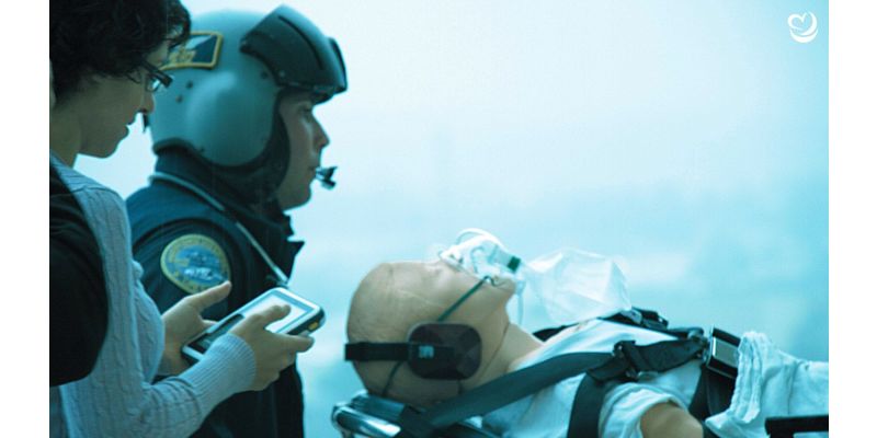 MegaCode Kelly manikin on stretcher being transported to a helicopter during a simulation