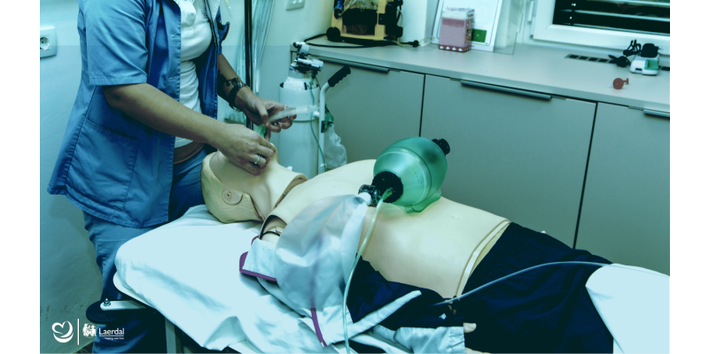 Clinical student practicing intubation on a Laerdal Resusci Anne manikin