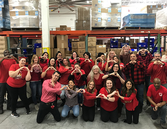 Group of WorldPoint employees wearing red for Go Red for Women Day